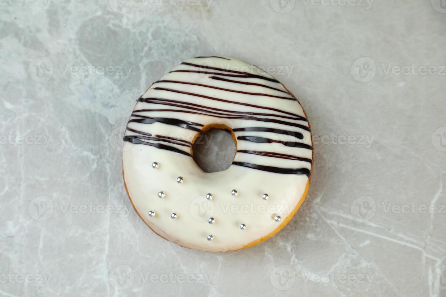 White Chocolate Donut served in plate isolated on grey background top view of baked food breakfast on table photo