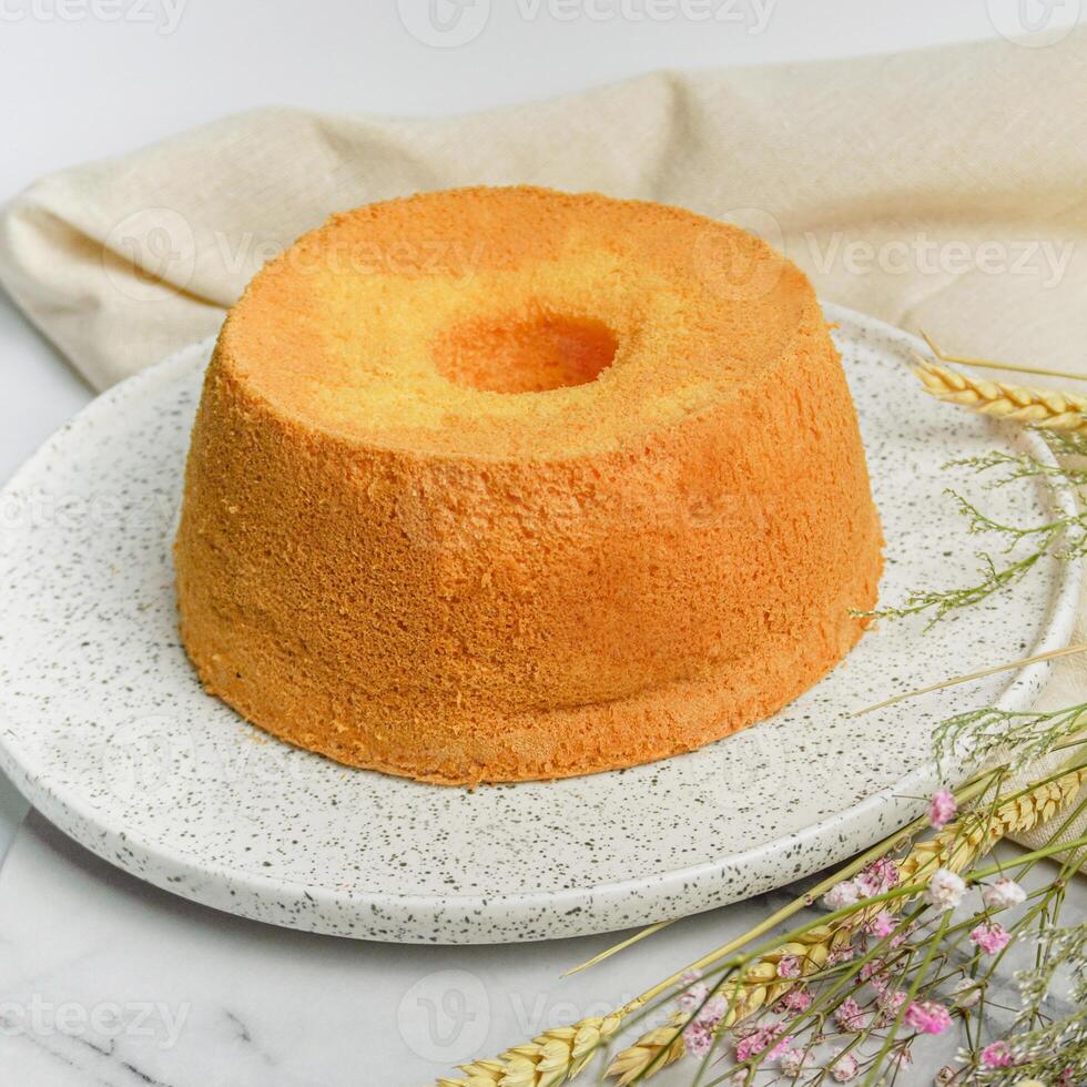 Orange Chiffon cake isolated on white background top view of bakery items food photo