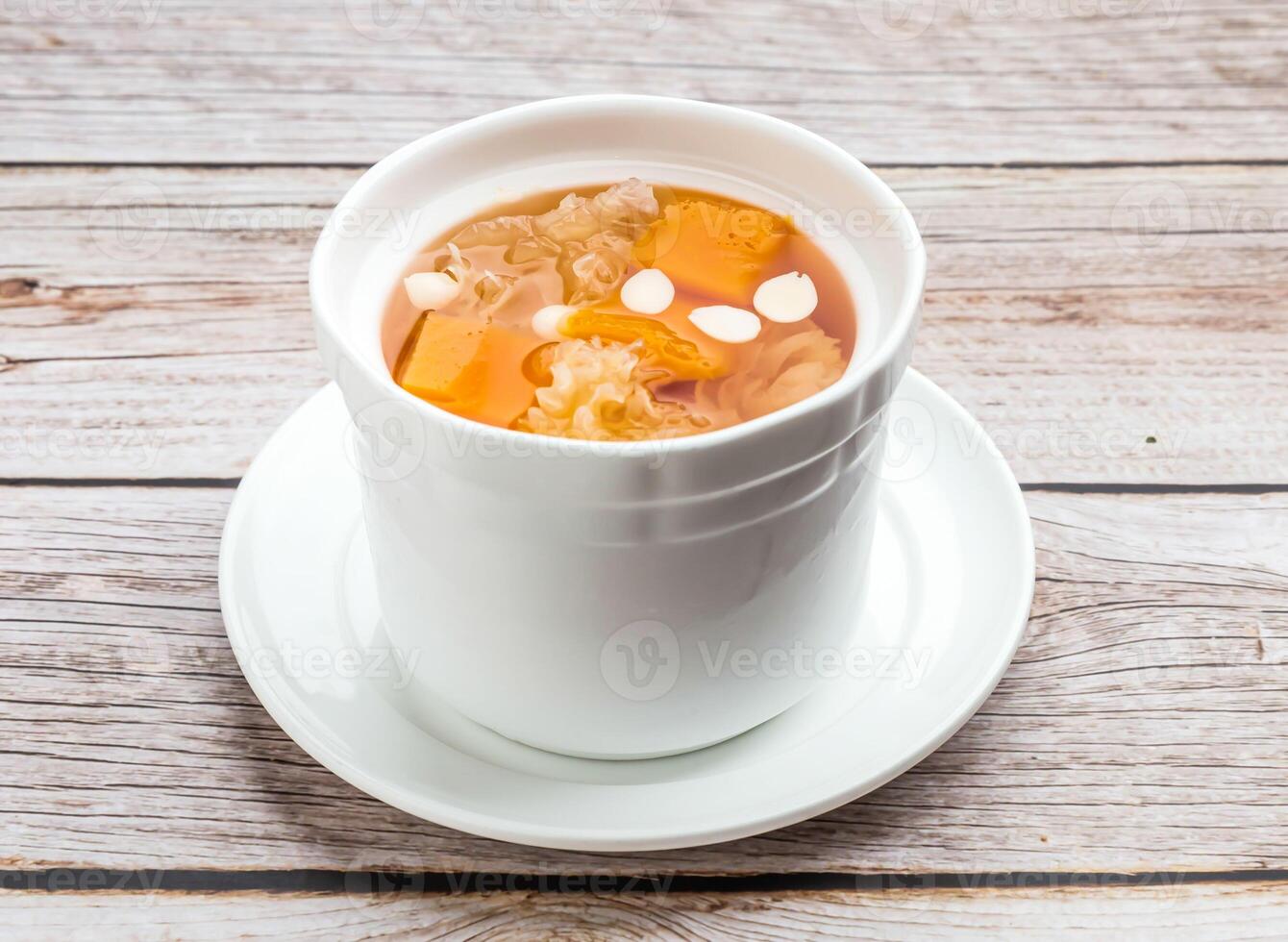 stewed papaya with silver fungus served in dish isolated on wooden table top view hong kong food photo