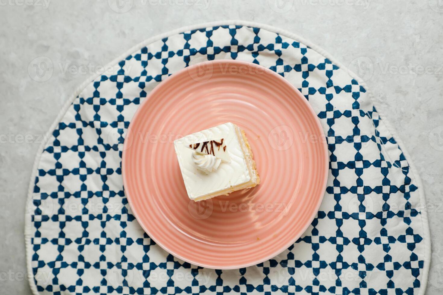 Square Vanilla Cake served in plate isolated on napkin top view of cafe baked food on background photo