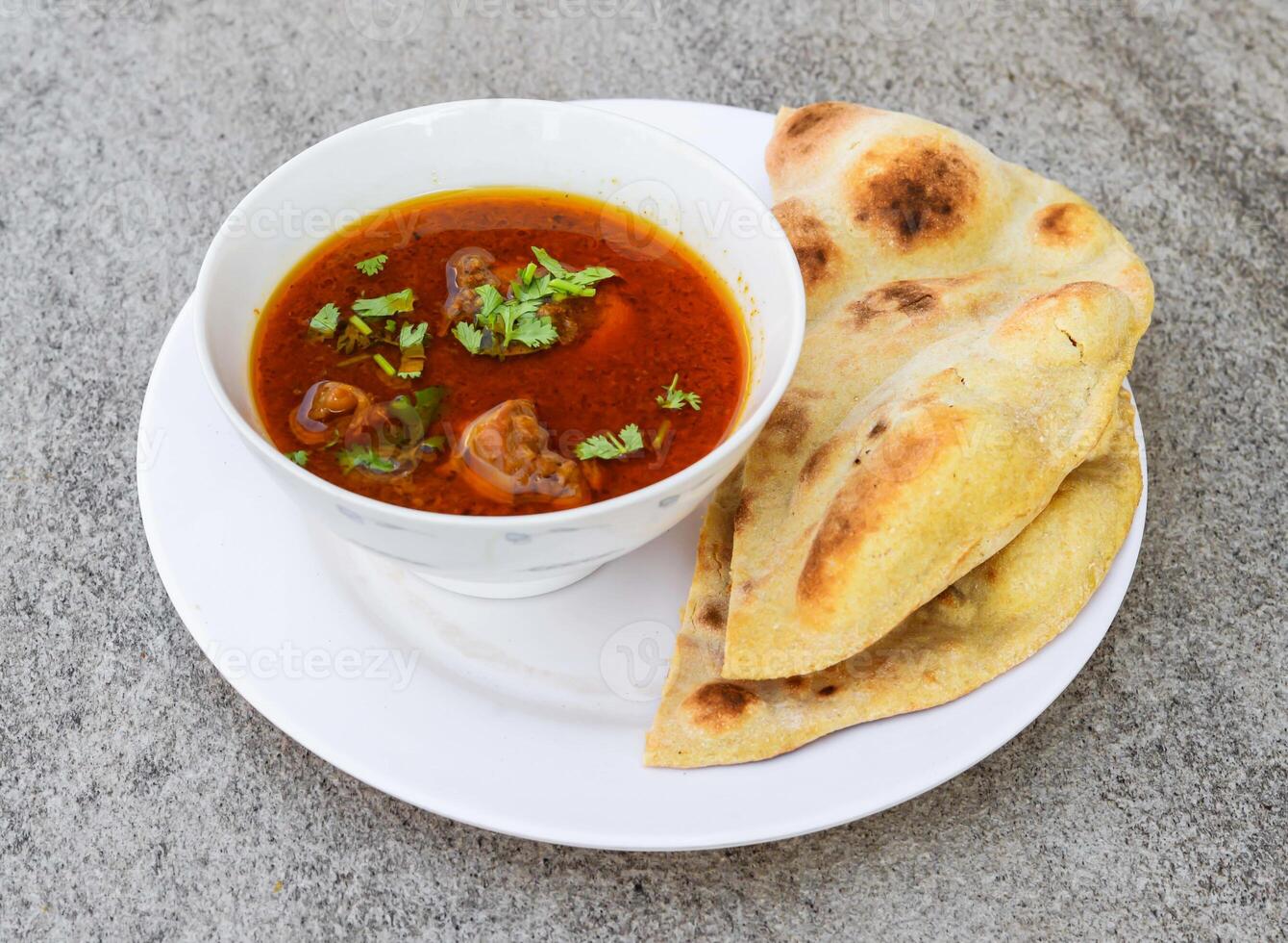 shahi chicken korma, qorma karahi masala with naan, roti served in dish isolated on background top view of indian spices and pakistani food photo