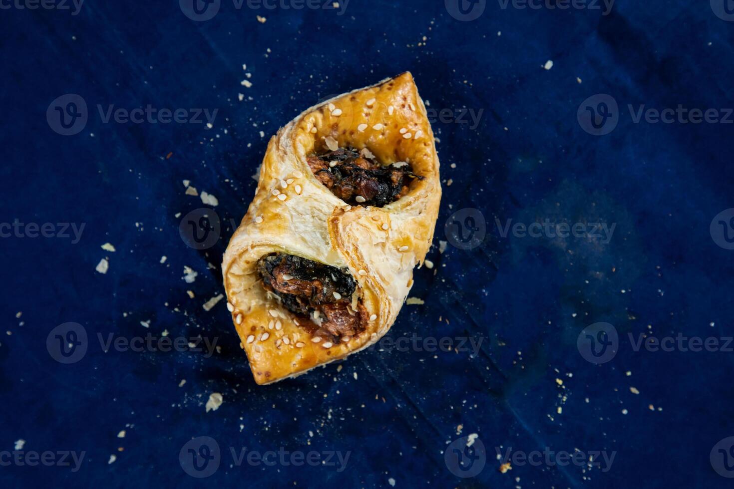 Spinach Puff with Sweet Corn isolated on blue background top view of savory snack food photo