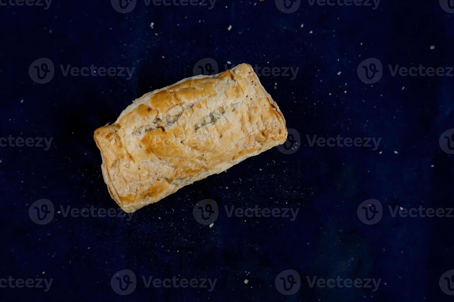 Mini Sausage Puff isolated on blue background top view of savory snack food photo