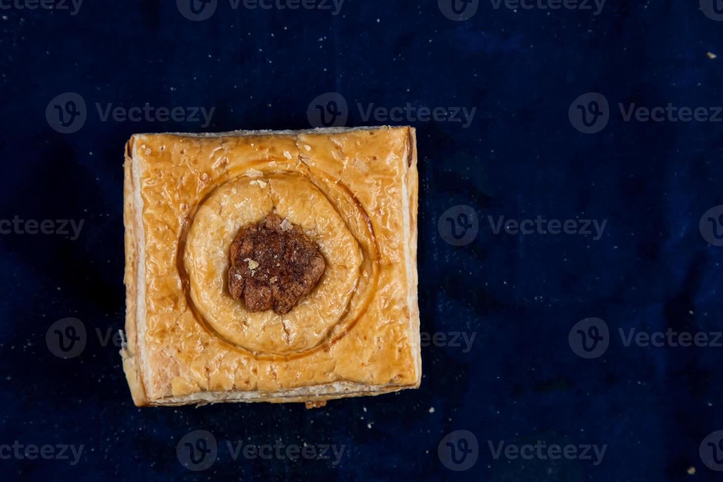 Salmon Wellington Puff isolated on blue background top view of savory snack food photo