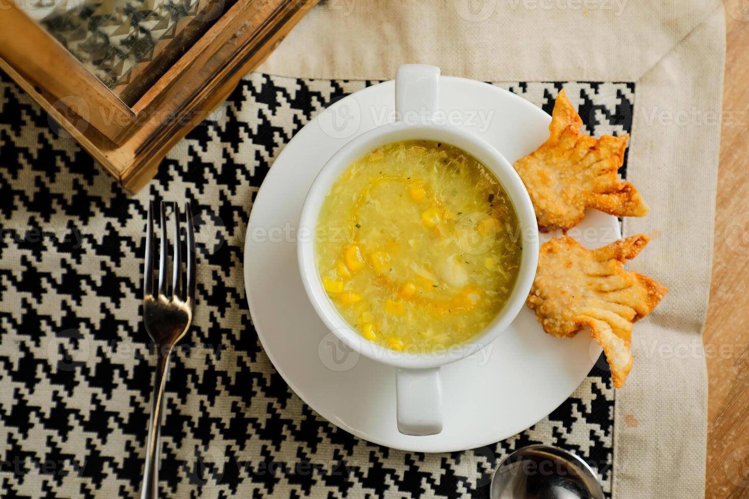 Sweet Corn Chicken Soup served in bowl isolated on napkin top view of chinese soup photo
