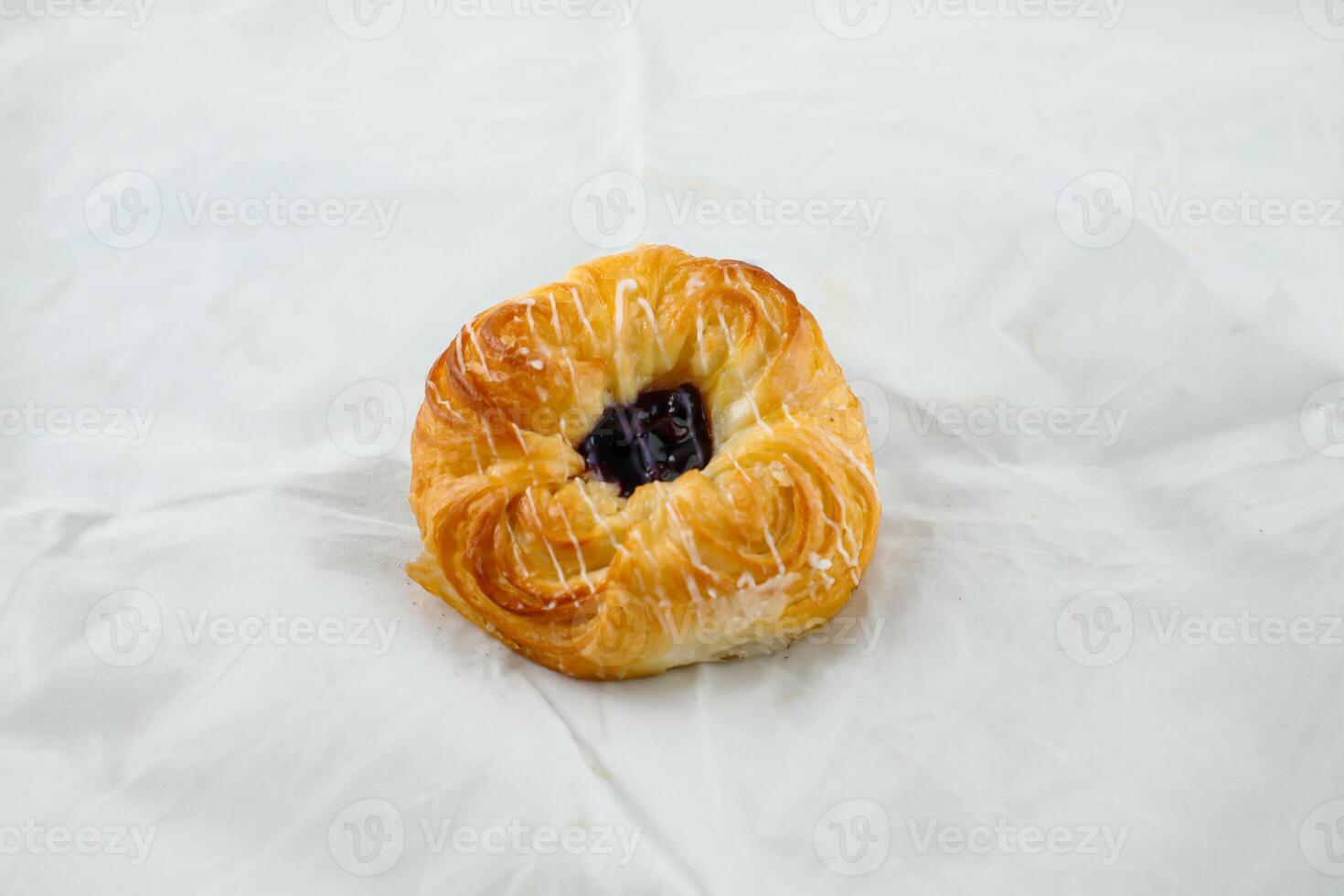 Blueberry Custard Danish served isolated on grey background side view of french breakfast baked food item on grey background photo