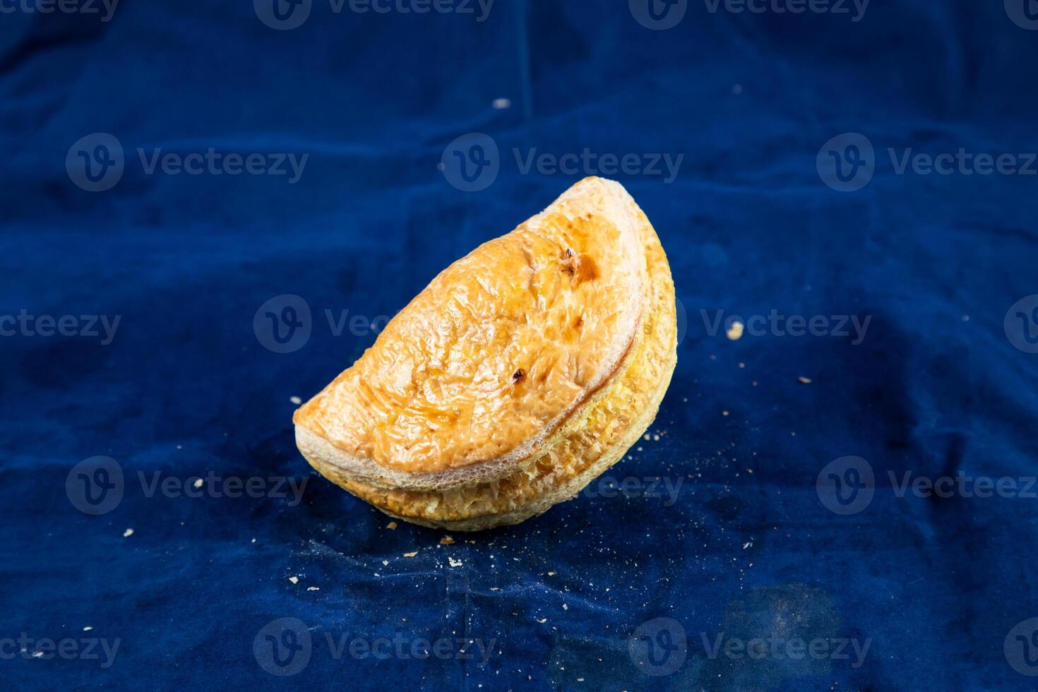 Beef Patties isolated on blue background side view of savory snack food photo