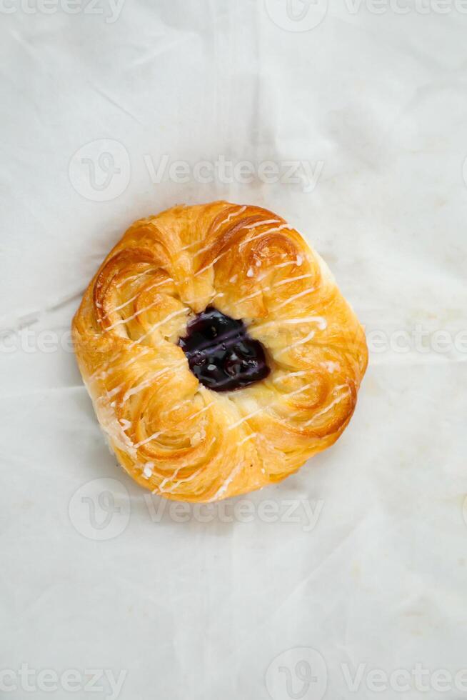 Blueberry Custard Danish served isolated on grey background top view of french breakfast baked food item on grey background photo