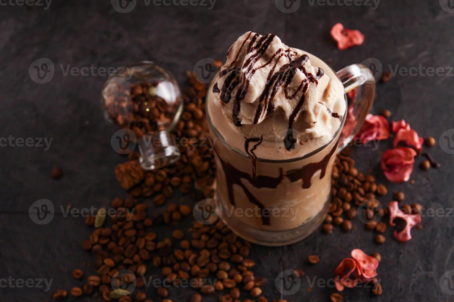 Mocha Chocolate with coffee beans served in glass isolated on table side view of healthy drink photo