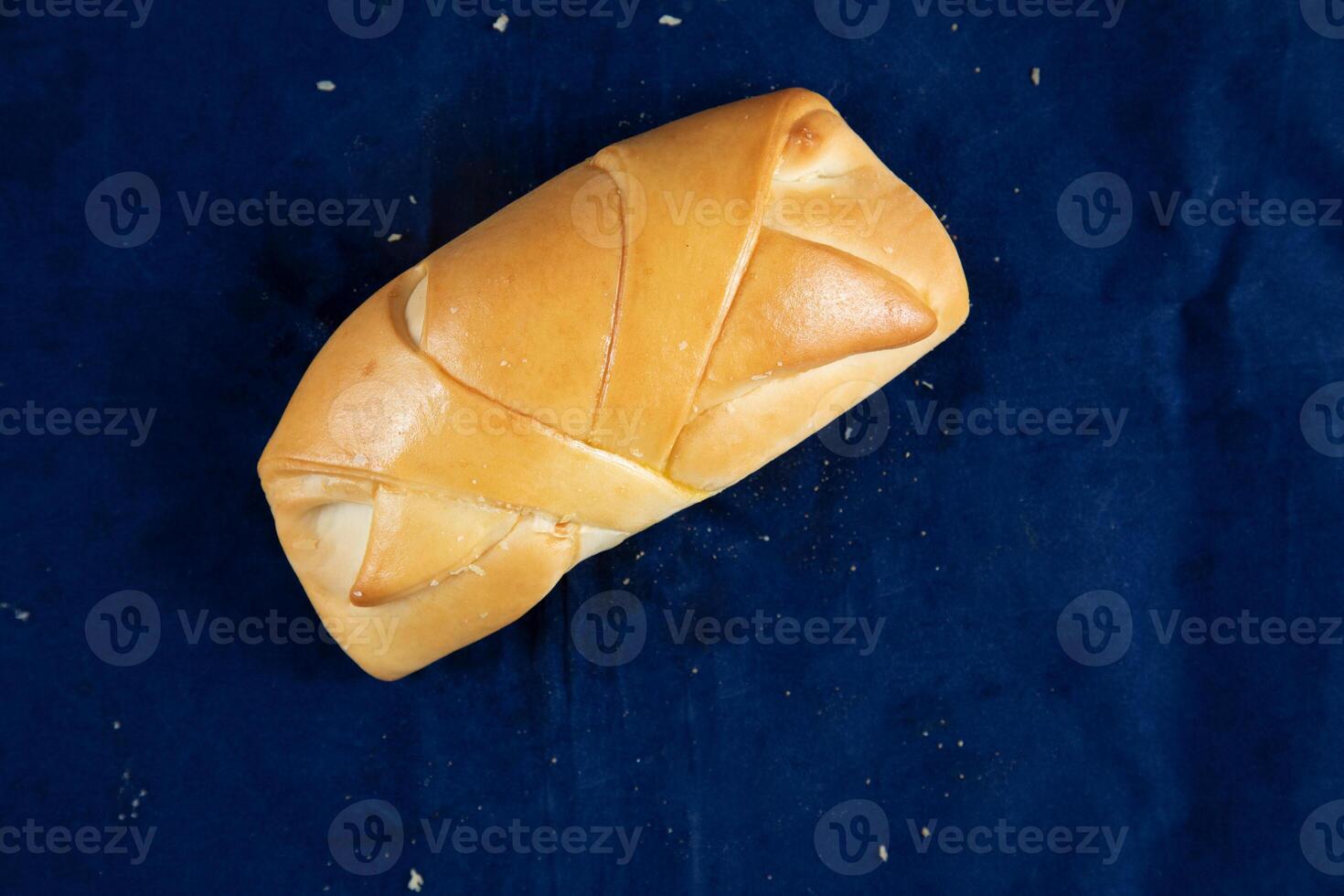 Vegetable Puff isolated on blue background top view of savory snack food photo