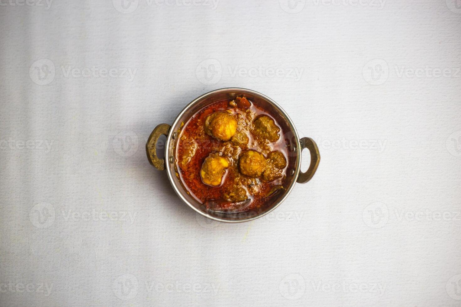 Beef goru bhuna karahi korma masala with gravy served in karahi isolated on background top view of bangladeshi, indian and pakistani traditional spicy food photo