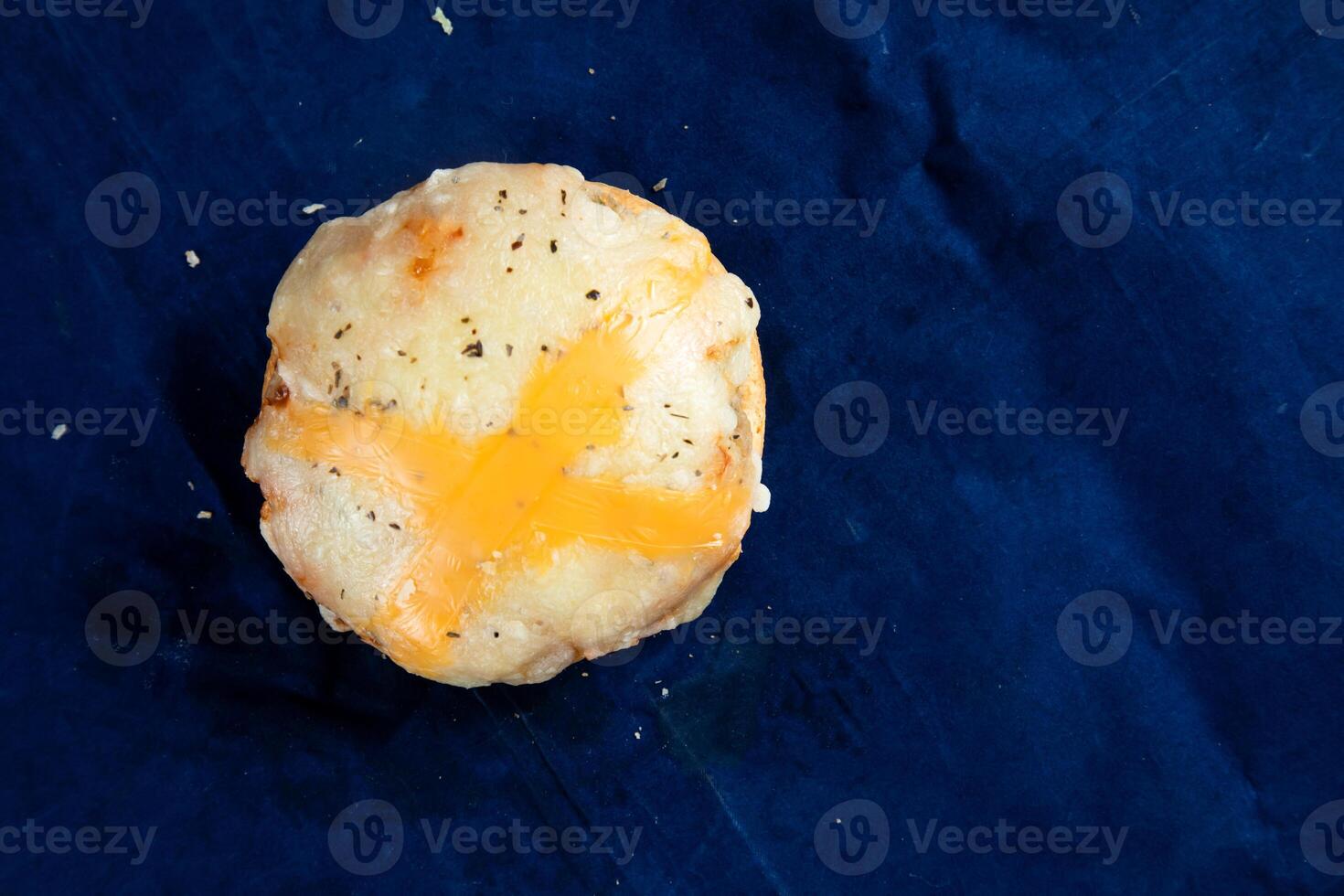 Crispy Chicken Bun isolated on blue background top view of savory snack food photo