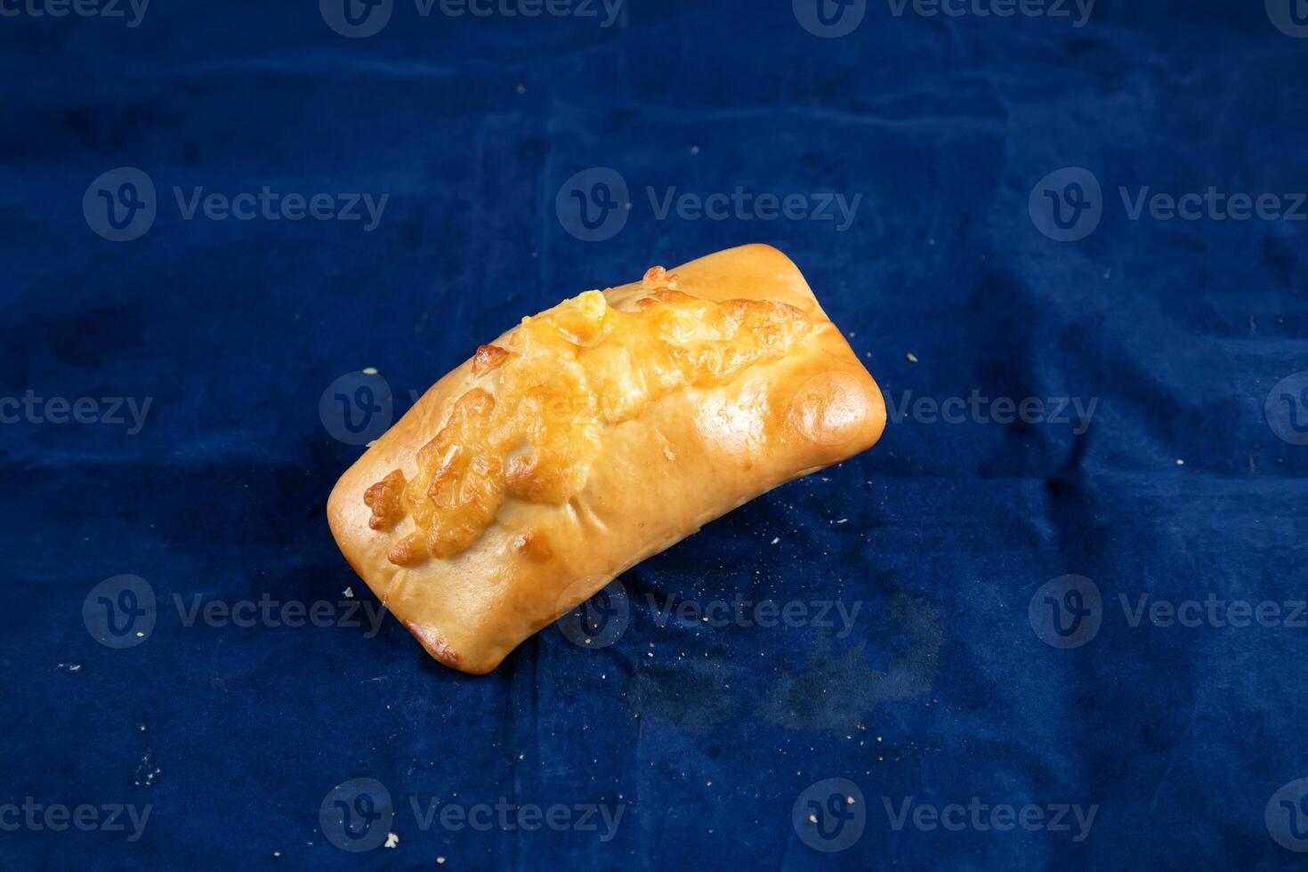 Beef Roll isolated on blue background side view of savory snack food photo