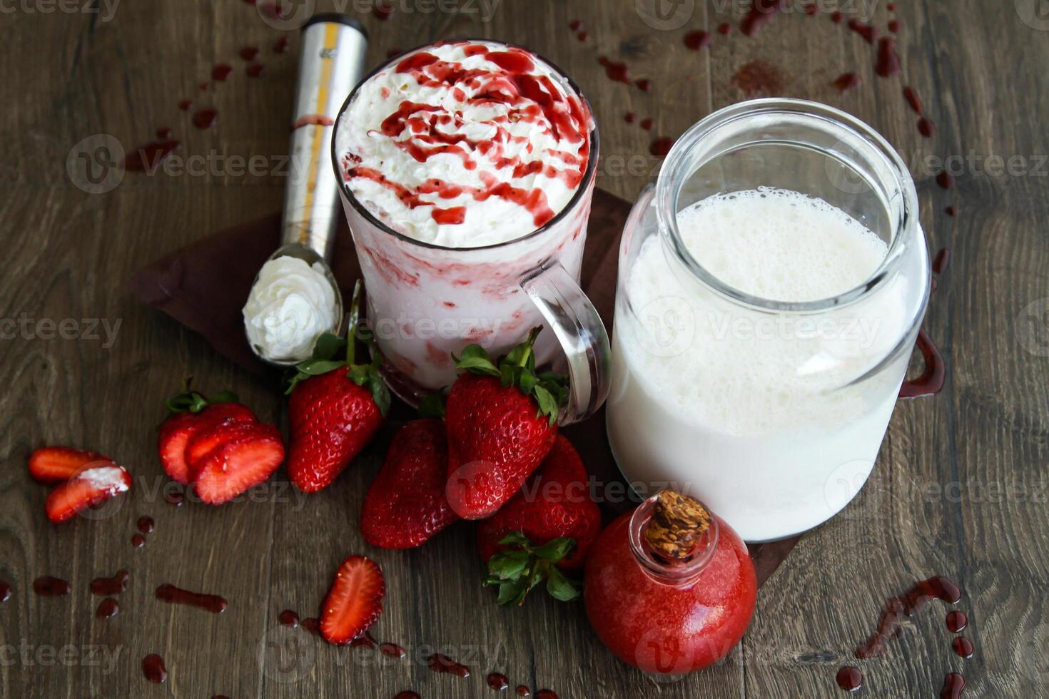 Strawberry vanilla ice cream shake served in glass isolated on table side view of healthy drink photo