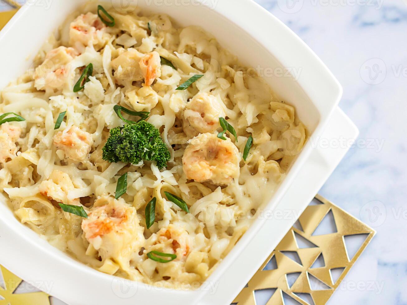 SHRIMPS FETTUCCINE with Cream Sauce Served in dish isolated on table closeup top view of italian food photo