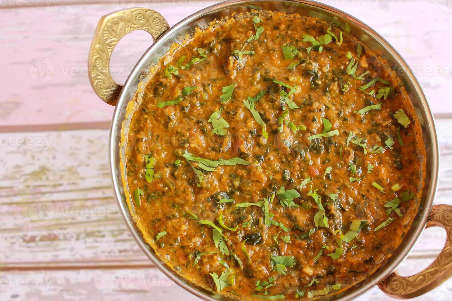Mutton Palak Gosht Korma served in karahi isolated on table closeup top view of indian spices food photo