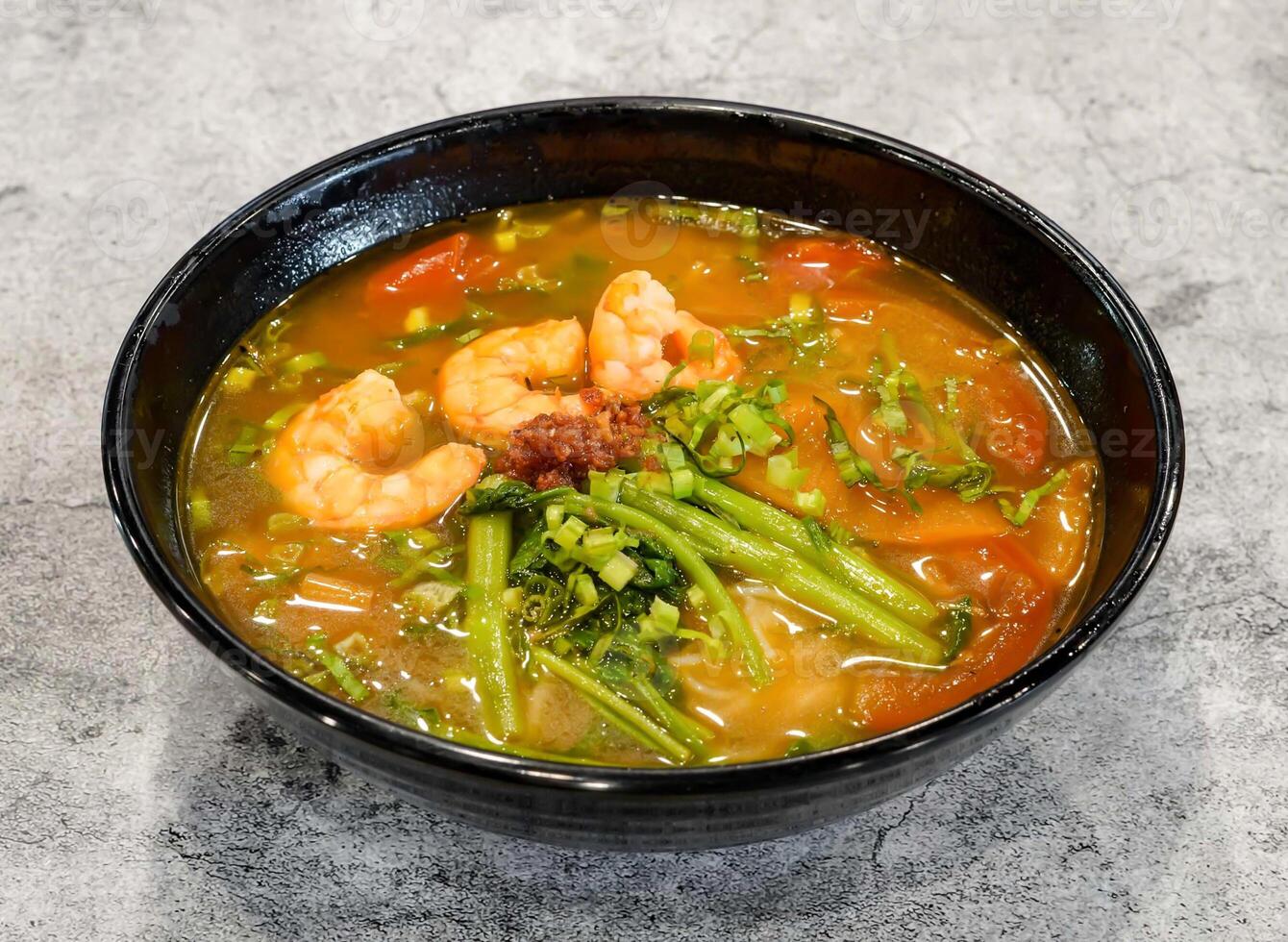 Kien Giang shrimp bun tep soup noodles with spring onion served in dish isolated on grey background top view of singapore seafood photo