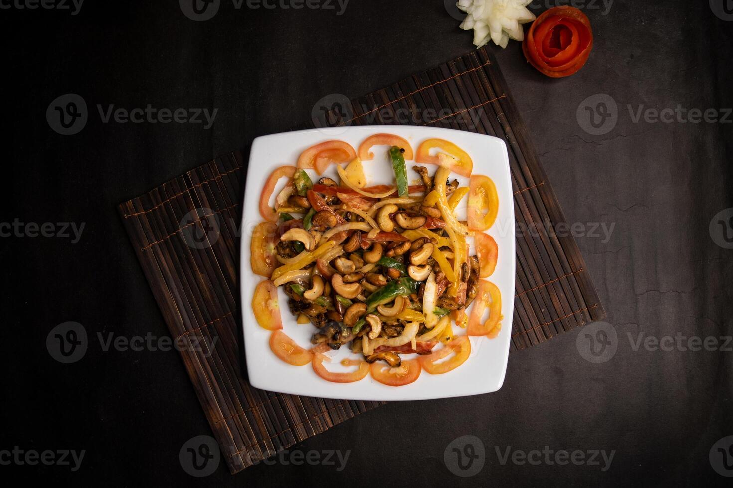 chicken vegetable cashew nut salad served in dish isolated on napkin mat top view of healthy supper food photo