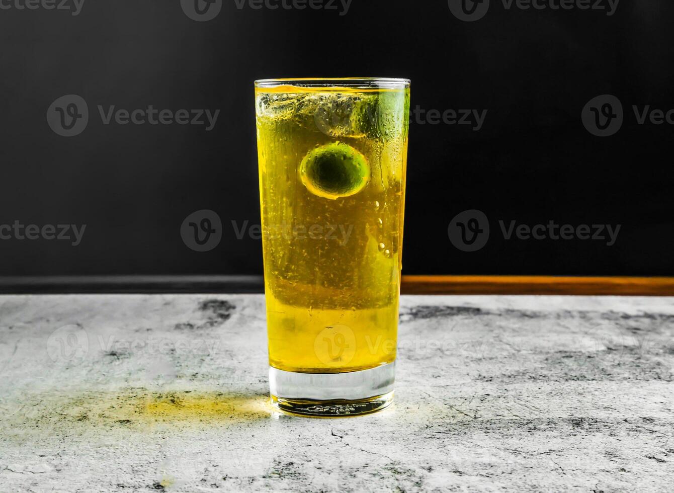 fresh lime nannari sarbath served in glass side view on grey background drink photo