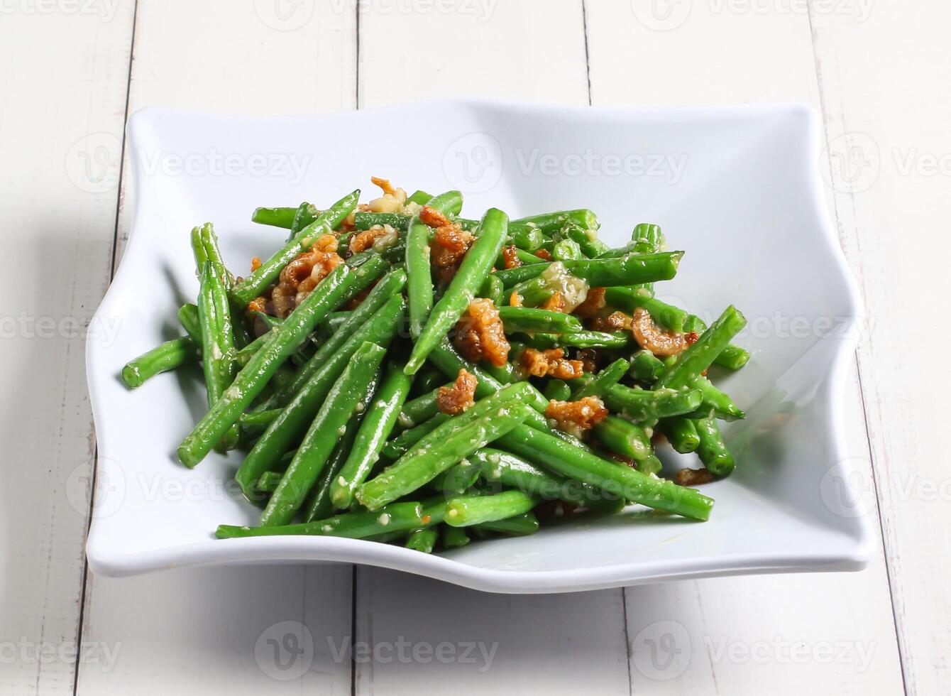 dried shrimp fried french beans served in dish isolated on table top view of singapore food photo