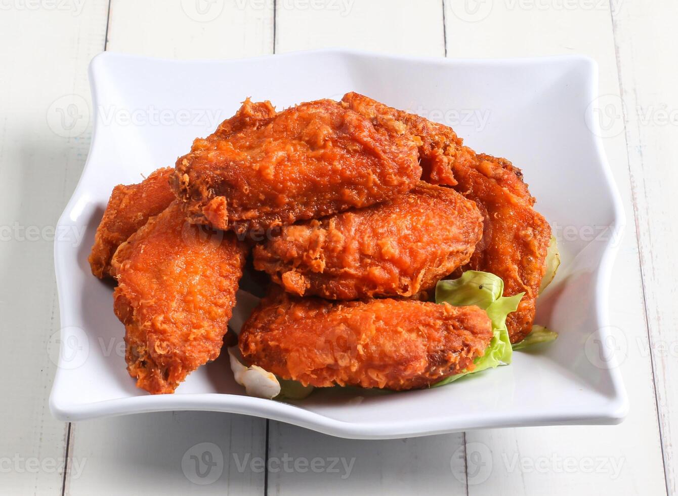 prawn paste chicken wings served in dish isolated on table top view of singapore food photo