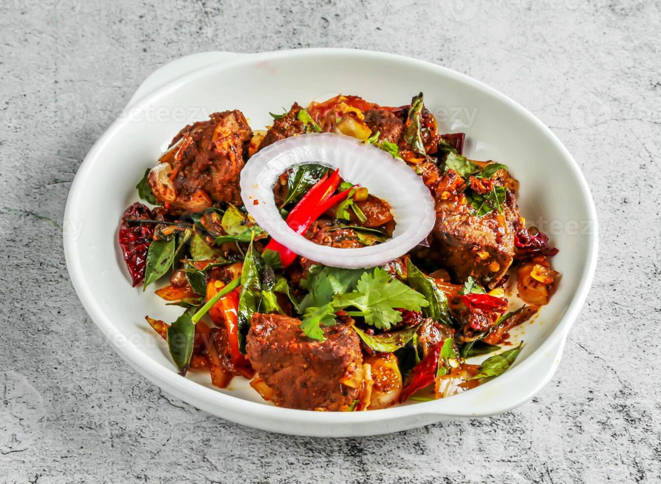 chettinad pepper mutton dry served in dish isolated on background top view of desi indian food photo