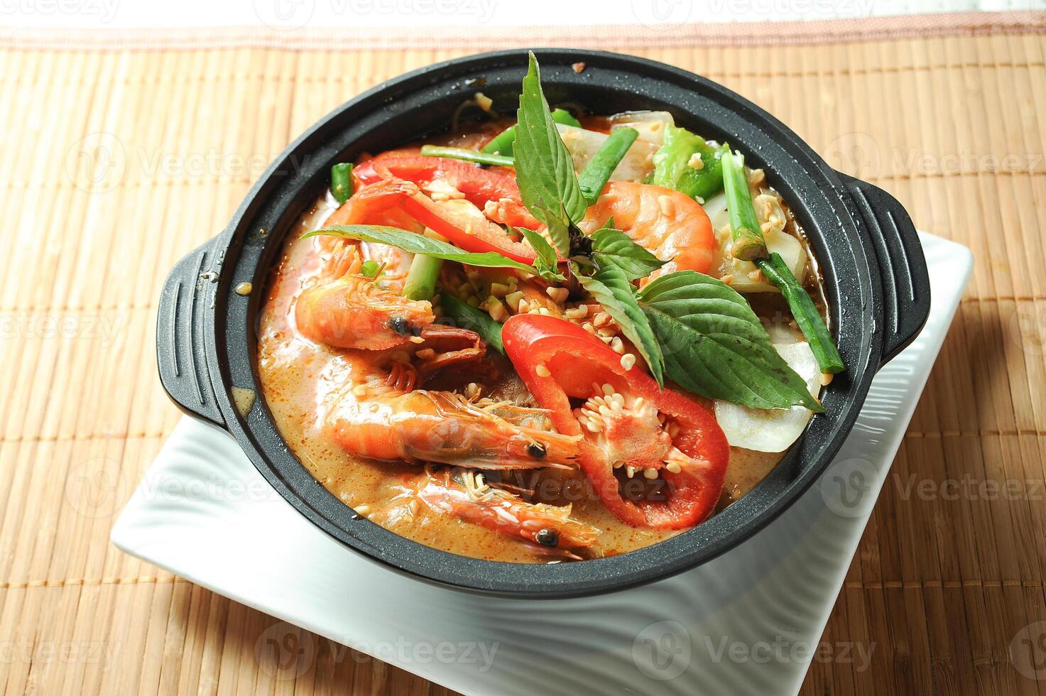 Satay Vermicelli Shrimp Casserole served in borth isolated on table top view of Claypot photo