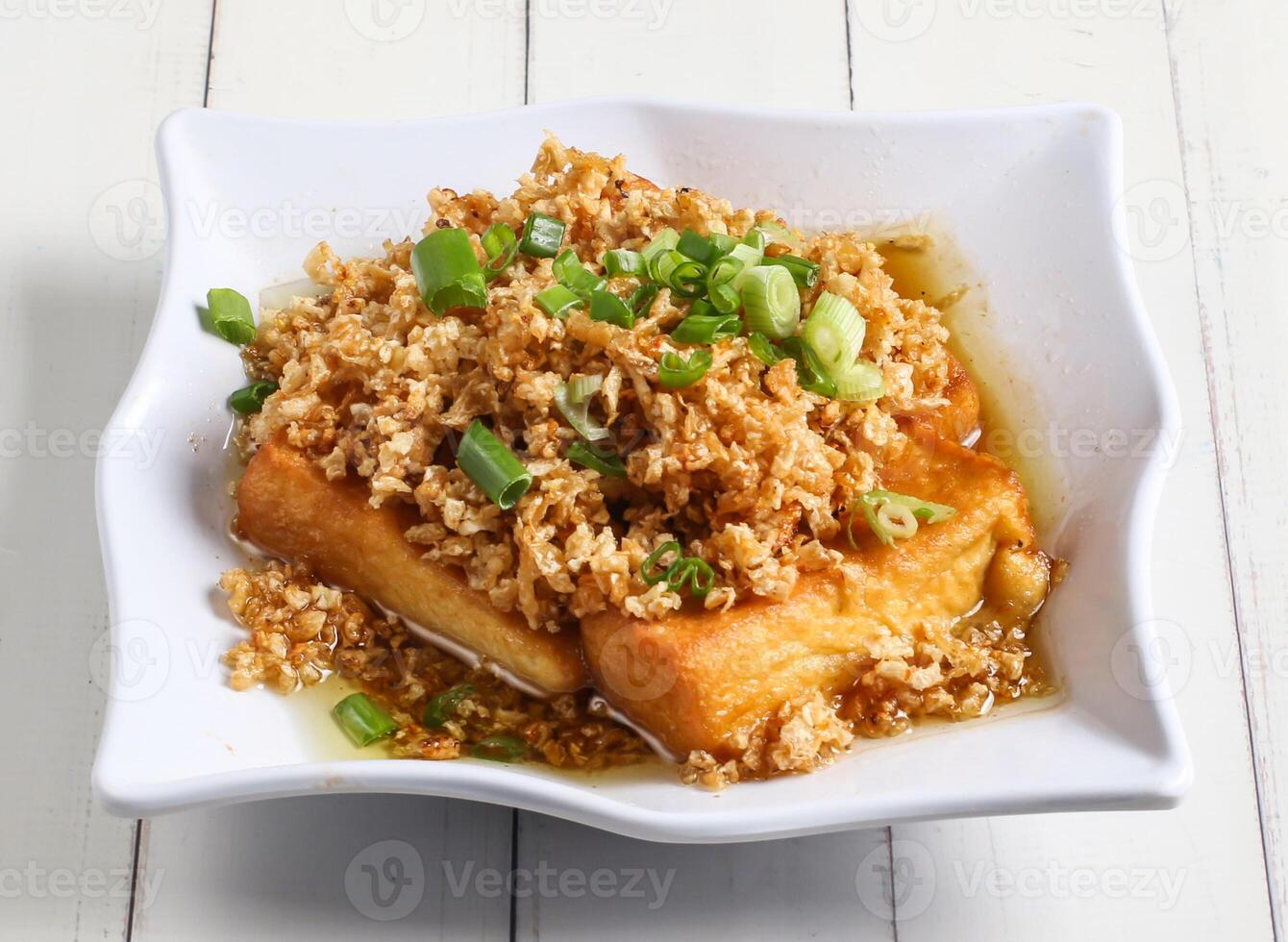 chaipoh tofu topping with spring onion served in dish isolated on table top view of singapore food photo