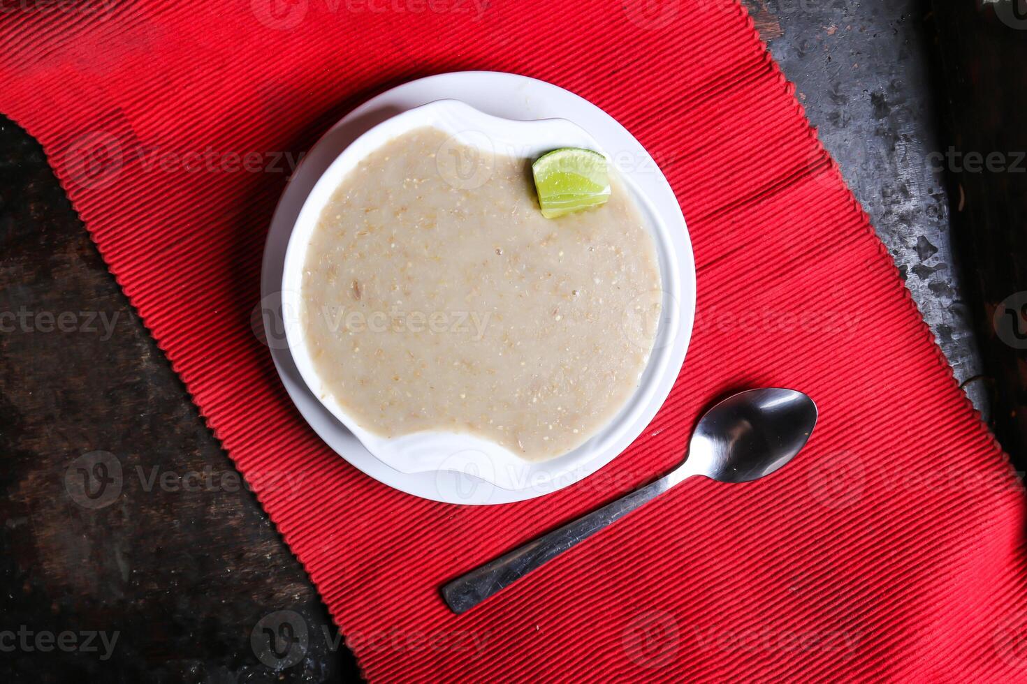 Harees Soup or hareesa served in dish isolated on red mat top view on table arabic food photo