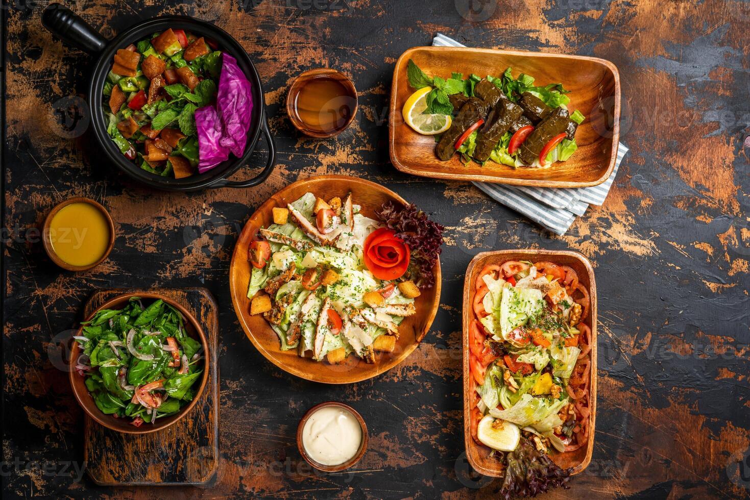 Assorted Supper Food fattoush, baba ganoush, Tabbouleh, vine leaves, chicken salad, served in dish top view green salads assortment photo