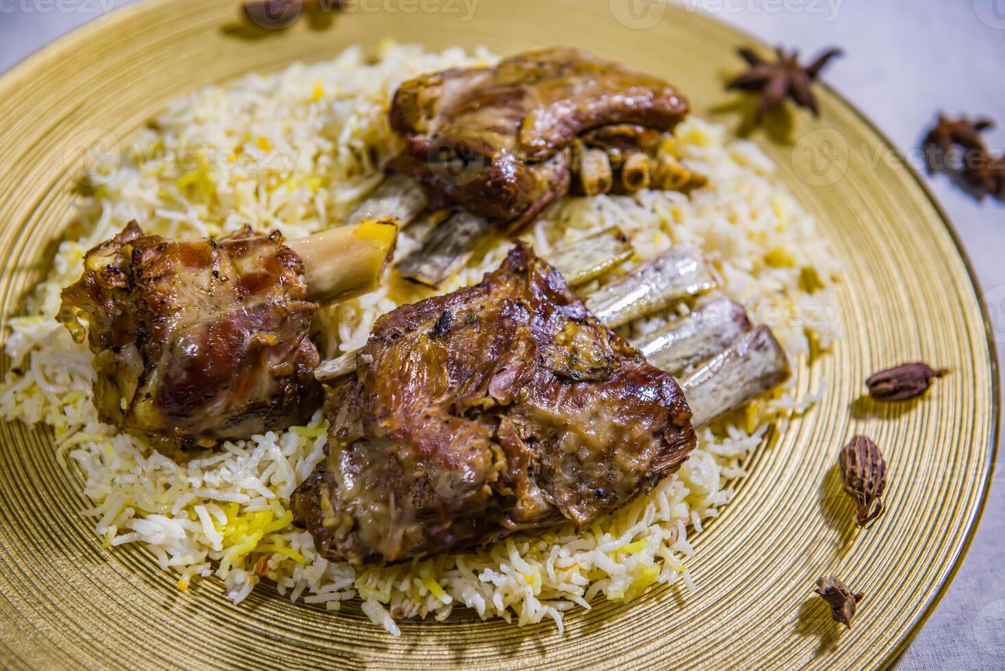 Laham mandi mutton biryani pulao rice mandy basmati served in dish isolated on food table top view of middle east spices photo