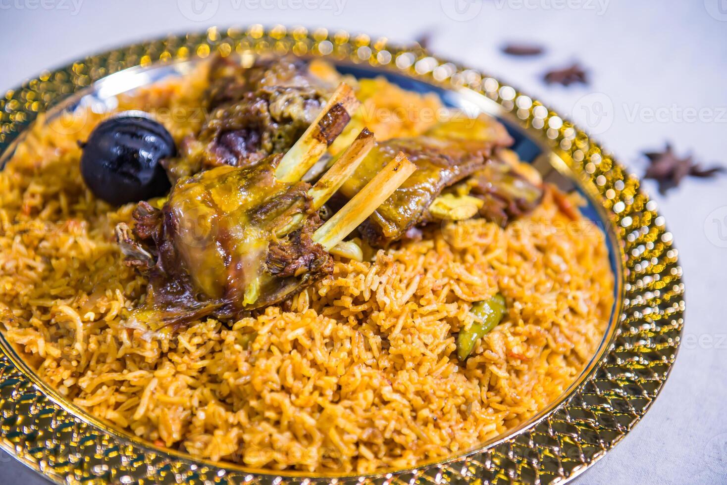 majboos laham mutton biryani pulao rice mandy basmati served in dish isolated on food table top view of middle east spices photo