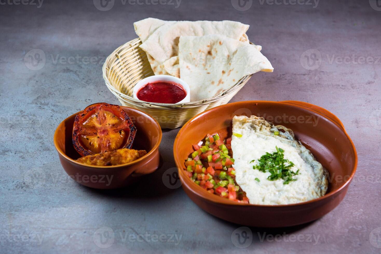 Egg White with salad, tomato, ketchup and bread served in dish isolated on grey background top view of bahrain food photo