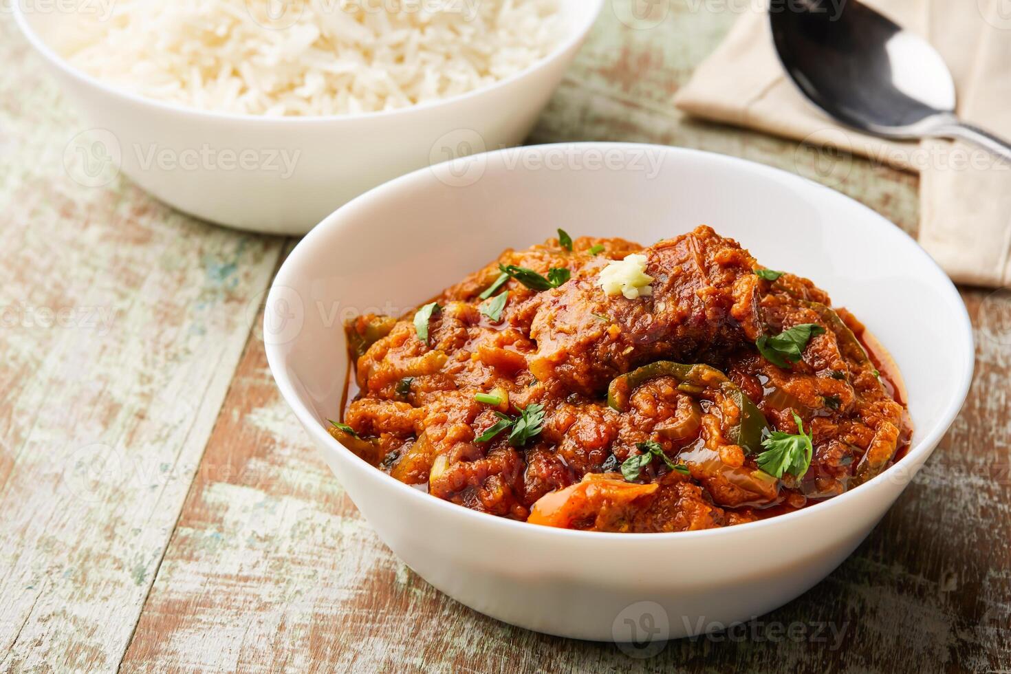 Fish Masala korma, curry karahi with boiled rice served in dish isolated on table top view of arabic food photo