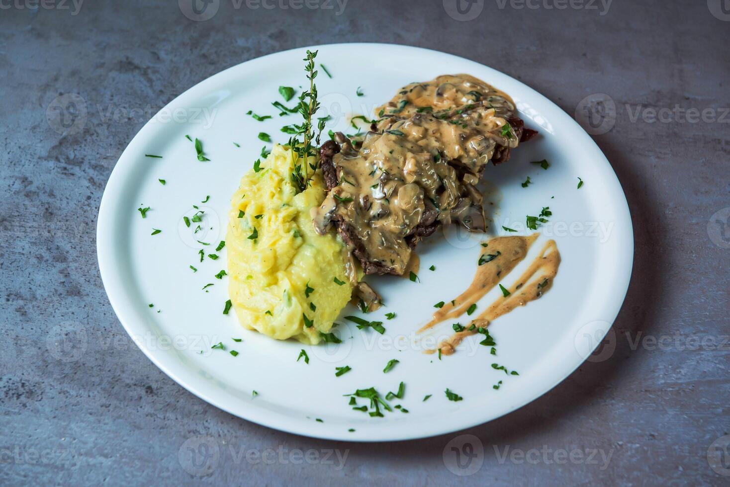 Steak Tenderloin with mash potato served in dish isolated on grey background top view of bahrain food photo