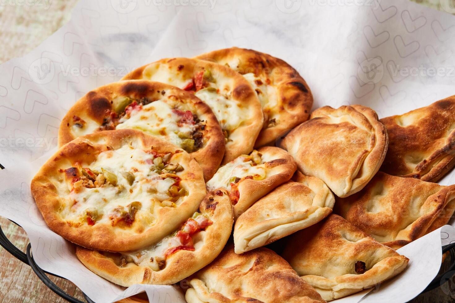 Assorted arabic Mini Pizza served in dish isolated on table top view of arabic food photo