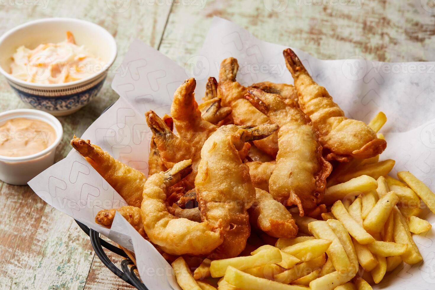 Fried Shrimp with french fries and mayo dip sauce served in dish isolated on table top view of arabic food photo