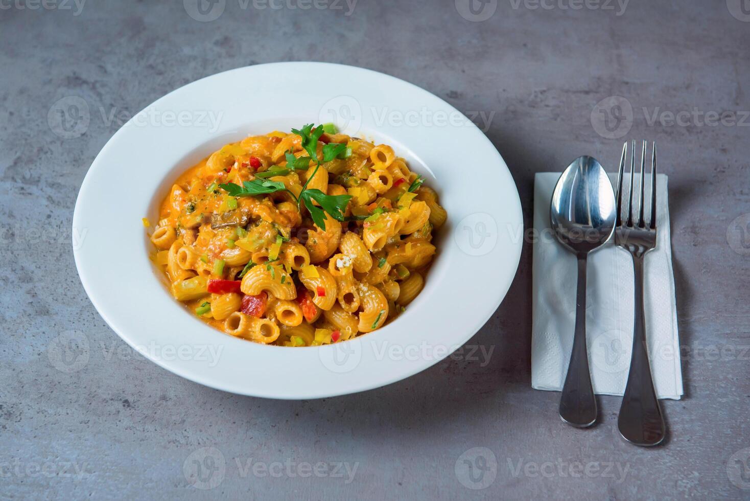 Shrimps Pasta with spoon served in dish isolated on grey background top view of bahrain food photo