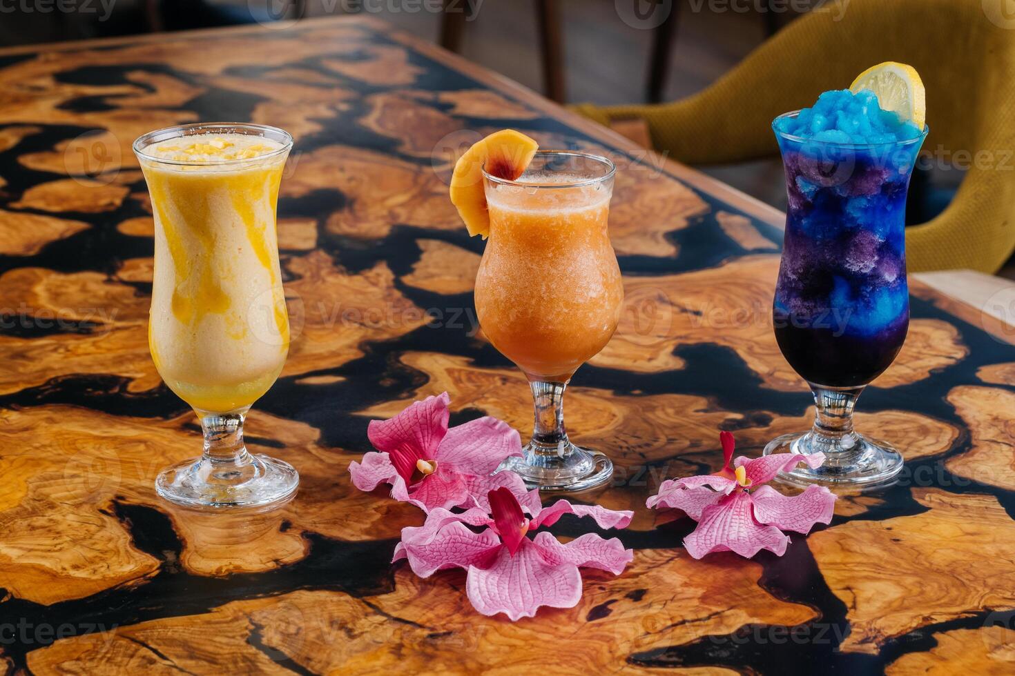 Assorted fruit juice of apple, strawberry, watermelon, passion fruit, mango, orange served in glass isolated on table side view of healthy morning arabic drink photo