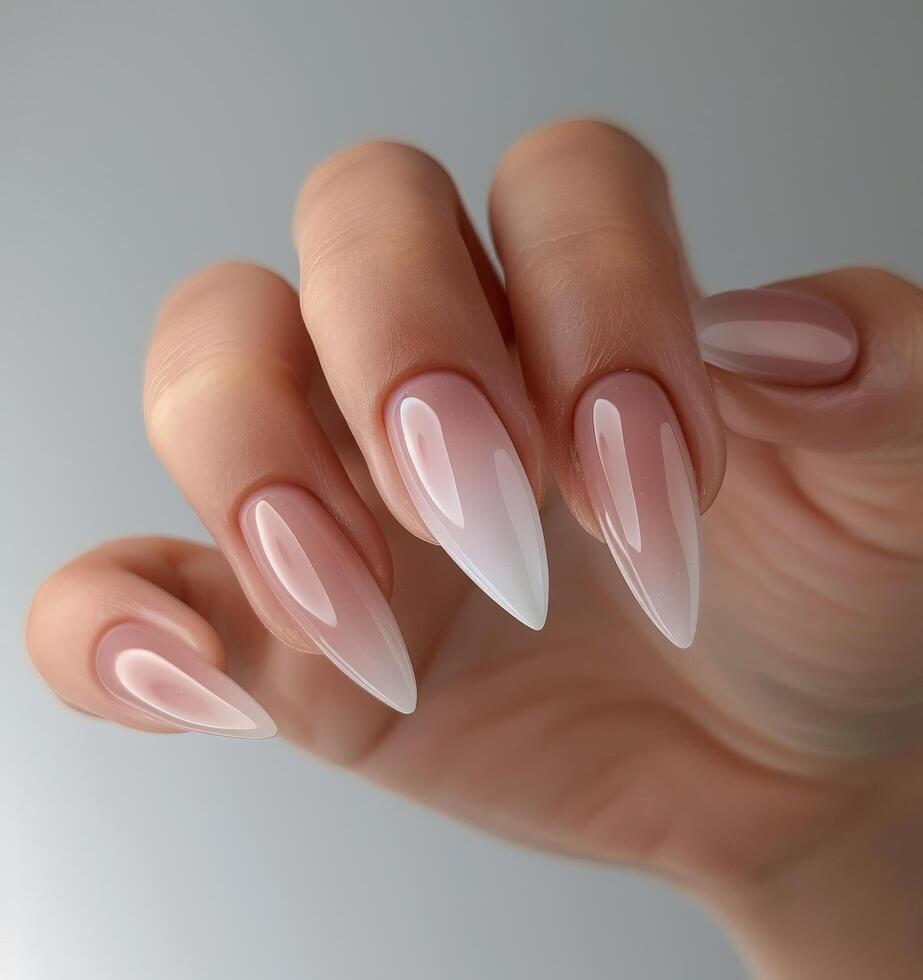 Womans Hand With Pink and White Nails photo