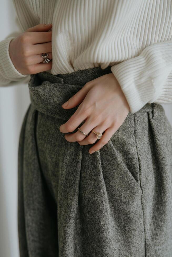 Woman Wearing White Sweater and Grey Pants photo