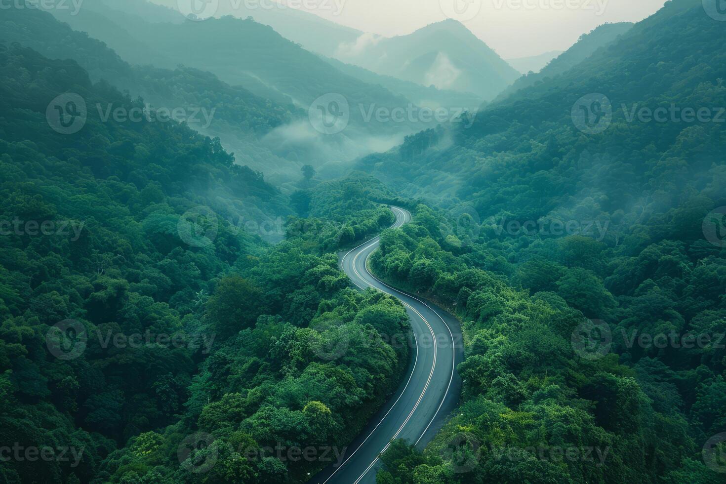AI generated Serpentine Mountain Road Winding Through Lush Green Forest photo