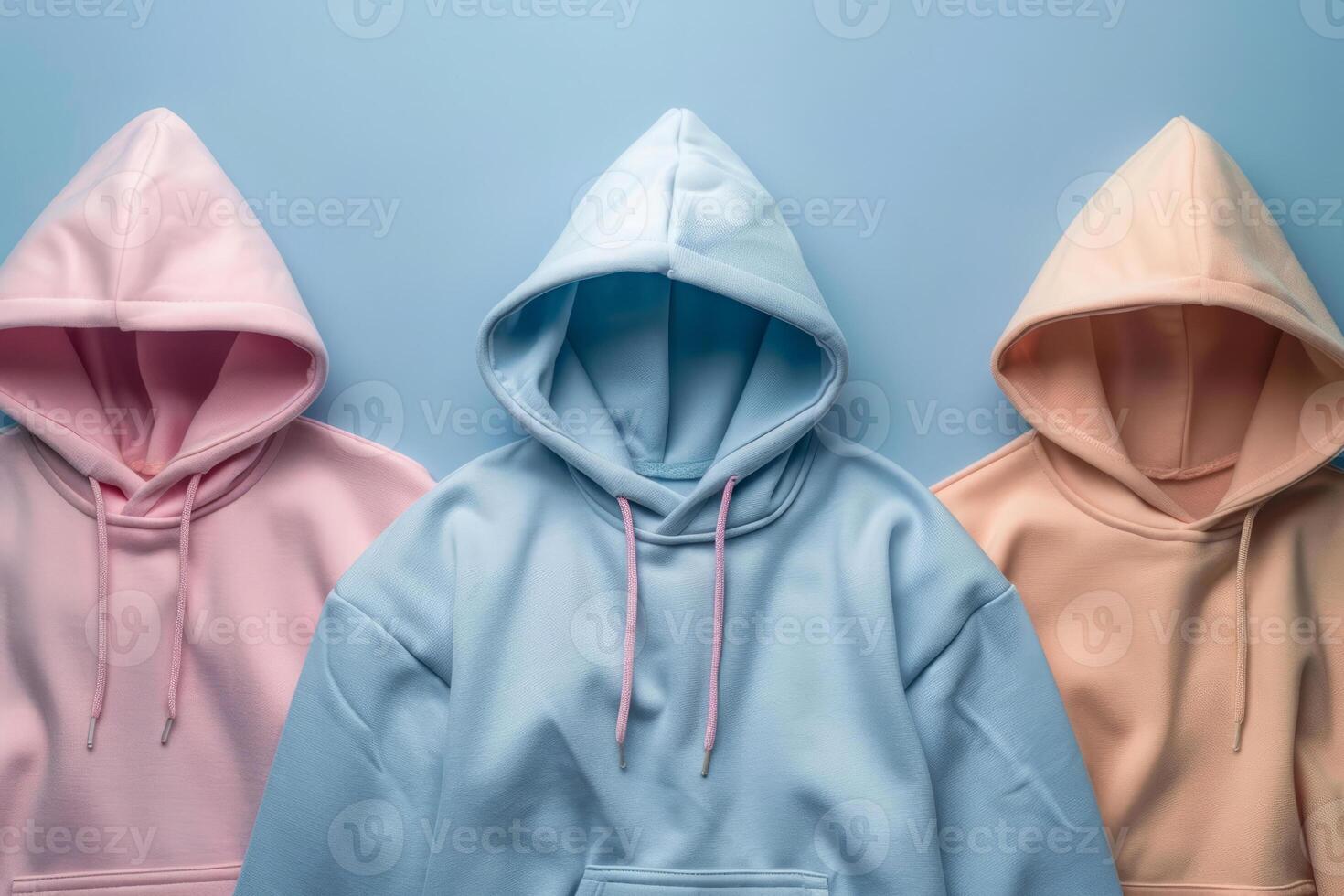 AI generated Lots of colorful hoodies hanging on blue background photo