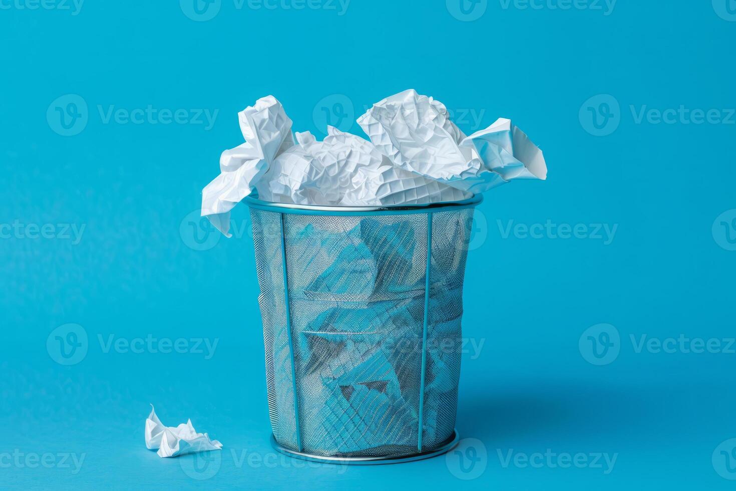 AI generated Waste basket with crumpled paper on blue background photo