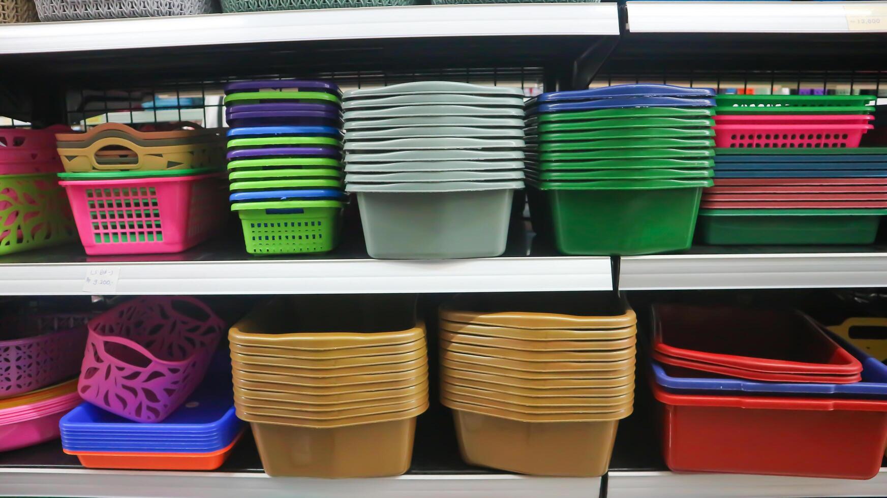 food storage containers and kitchen utensils on supermarket shelves for sale photo