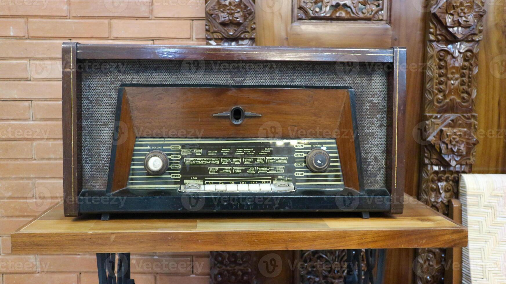 A traditional old Javanese radio with wood carvings photo