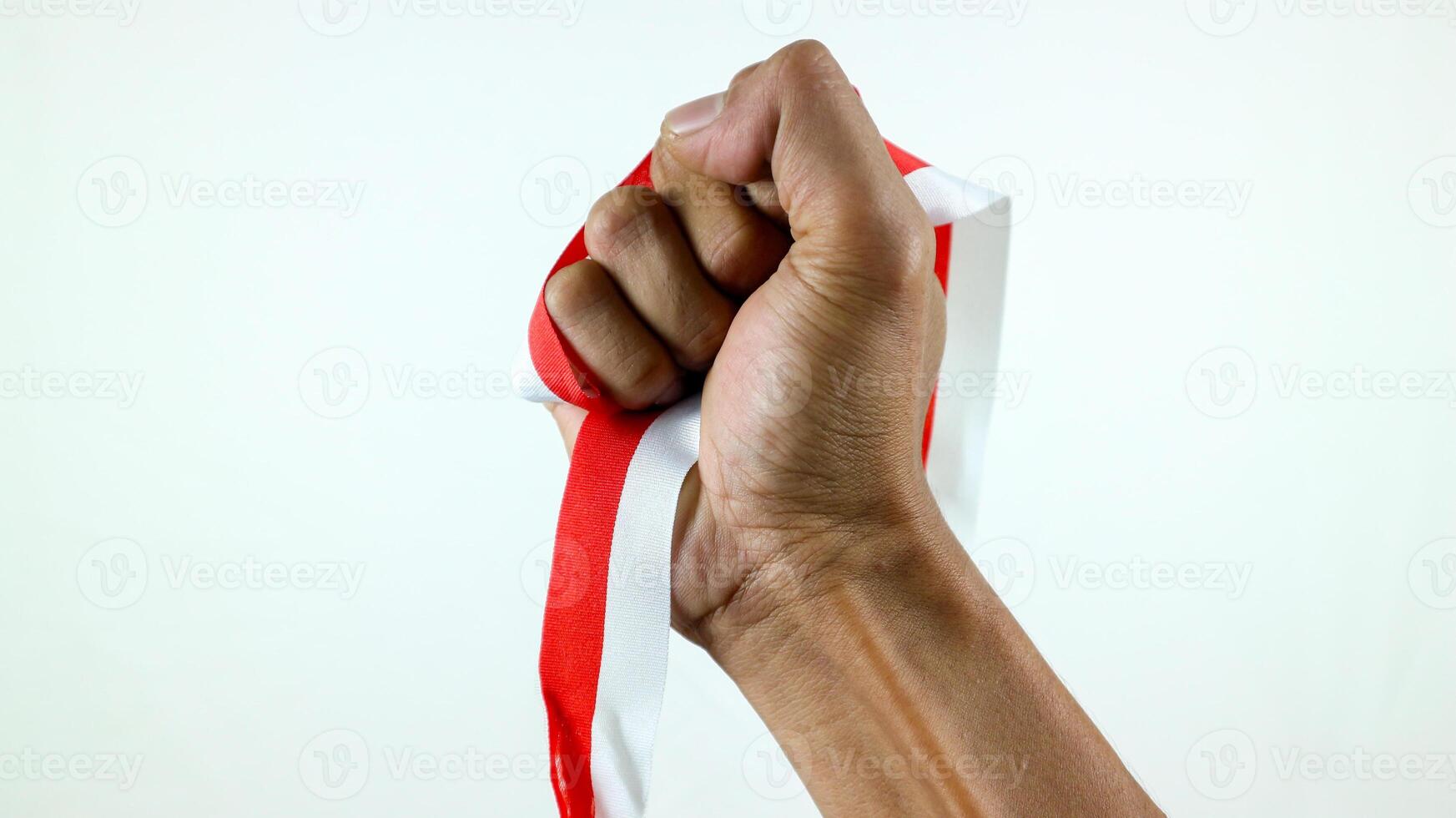 hand holding ribbon, red and white flag of Indonesia independence day August 17th, i love indonesia photo