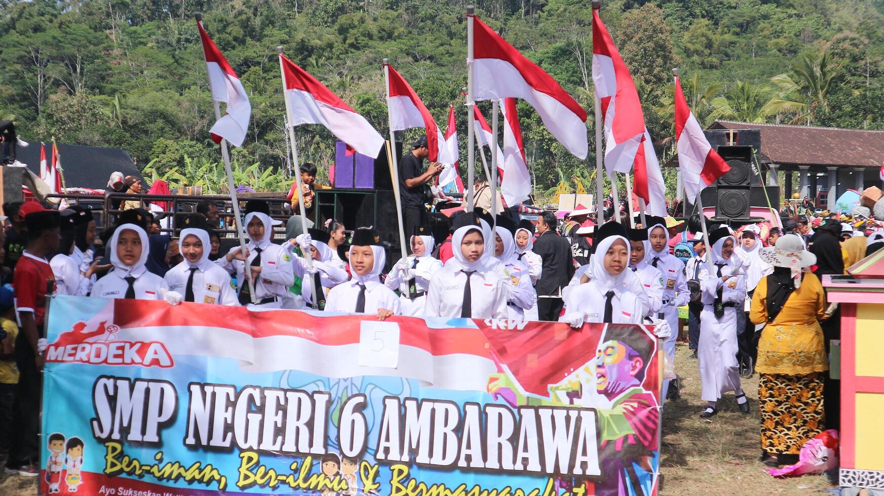 Ambarawa, August 17th 2023. Indonesian students bring red white flags in ceremony celebrating Independence Day. photo