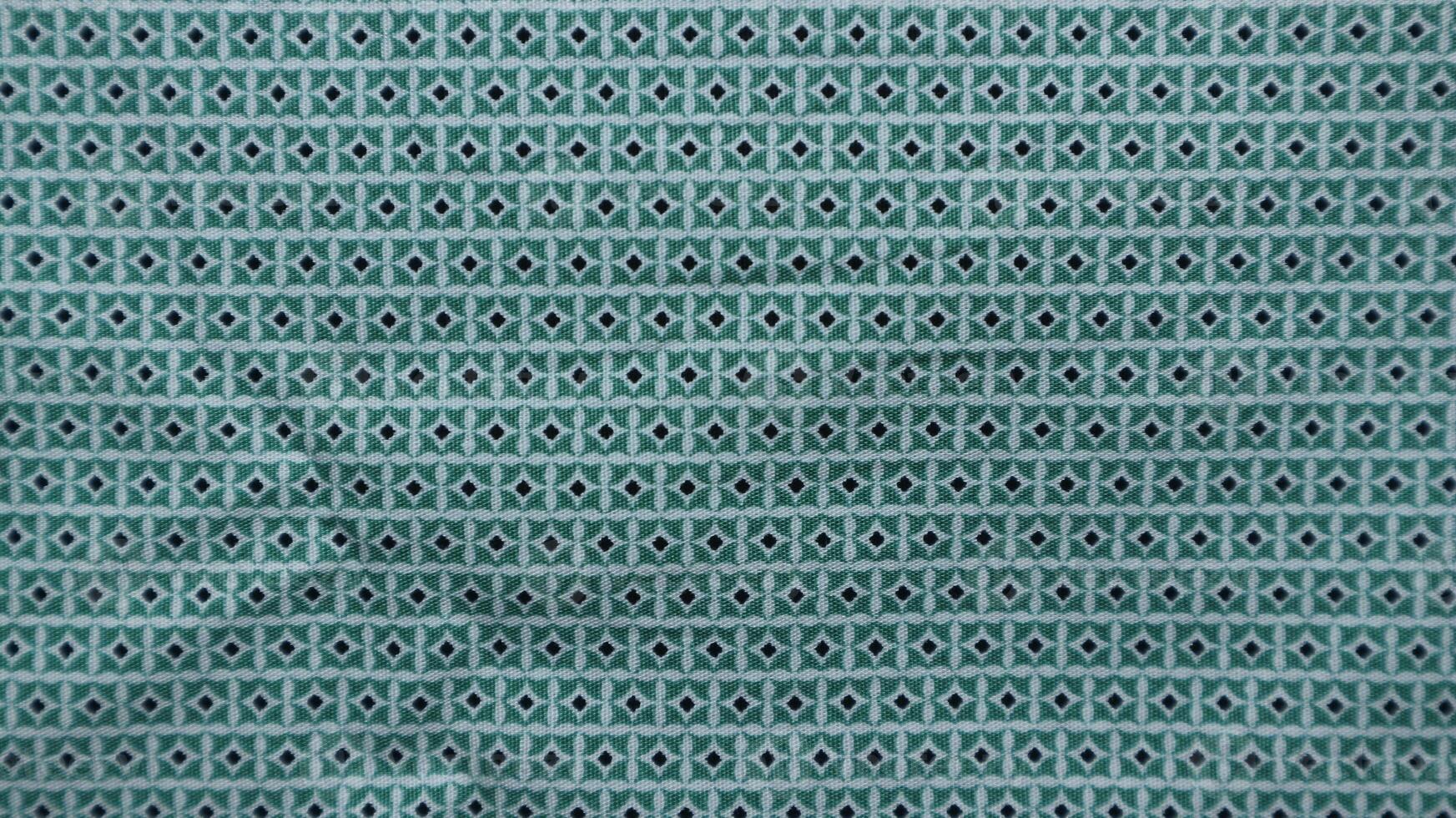 Geometric ethnic pattern made with straw in black and white. knitting fabric pattern for background photo