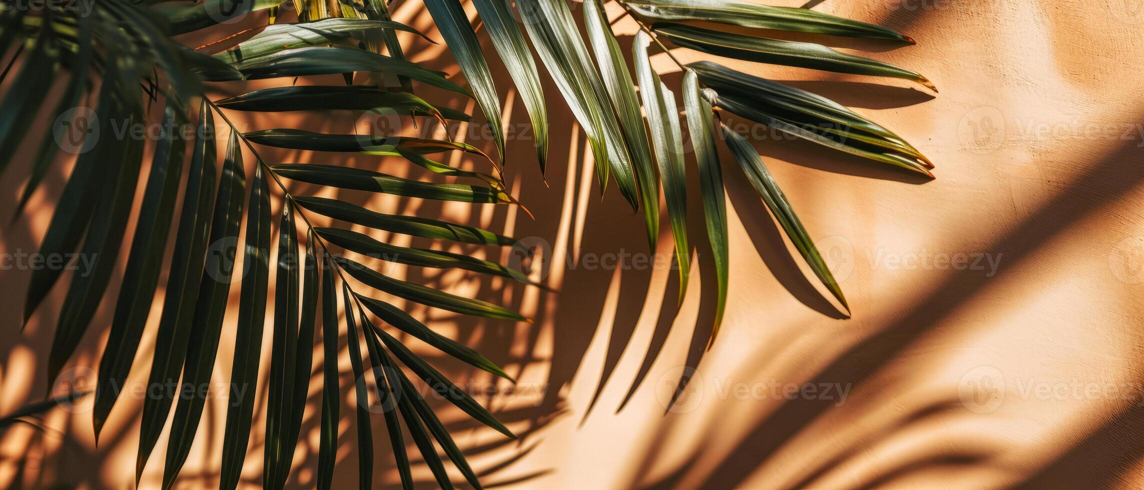 AI generated The interplay of light and shadow from tropical palm leaves creates an artistic pattern on a warm, textured wall photo